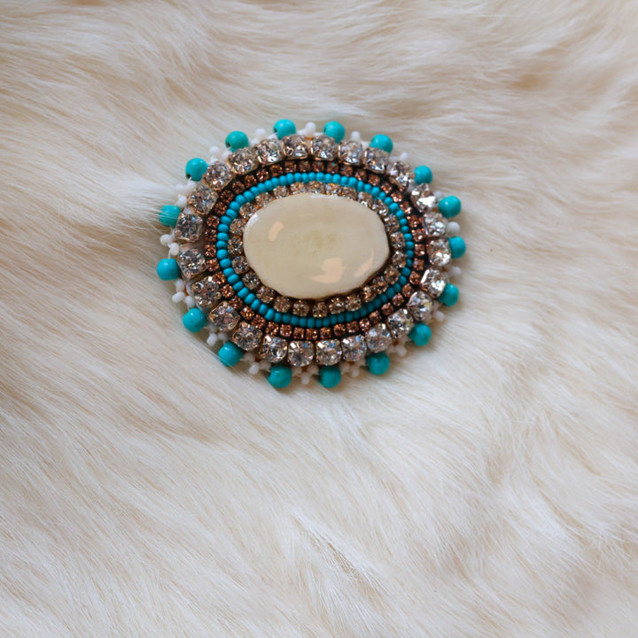 Mercedes G. Teal Antler Pin