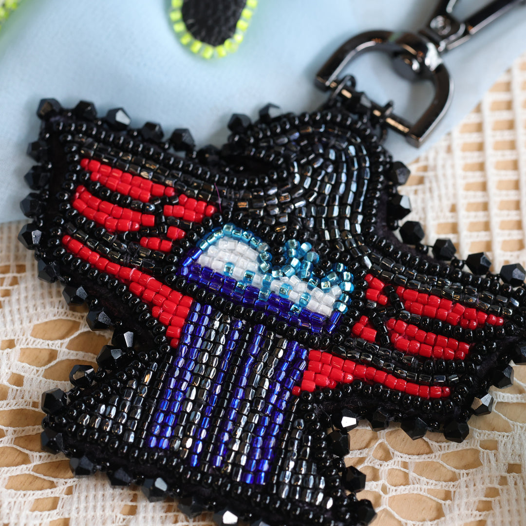 April Beadmaster Rochelle L. Thunderbird Charm & Lightning Earrings